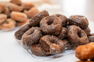 Stack of delicious fresh donuts on a plate 