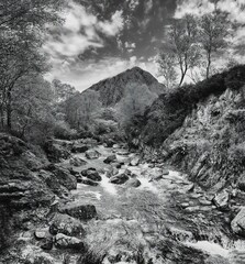 The River Coupall flowing through the countryside of Glencoe during autumn with a view of Buachaille Etive Mór mountain in Scotland. © Jonathan Dakin