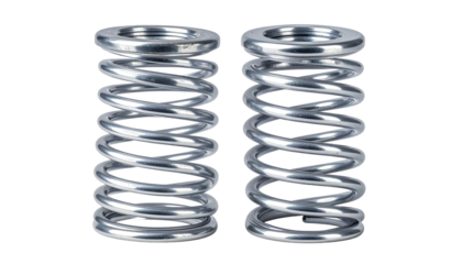 Two metallic coil springs standing upright, closely spaced, against black