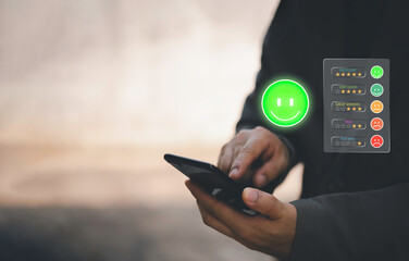 Businessman using smartphone to give five-star rating and positive feedback through virtual interface. Concept of customer satisfaction, user experience, review system, and digital feedback.