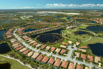 Fototapeta premium Aftermath of natural disaster. Surrounded by hurricane Ian rainfall flood waters homes in Florida residential area