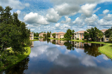 Fototapeta premium Apartment residential condos in Florida suburban area. American condominiums as example of real estate development in USA suburbs