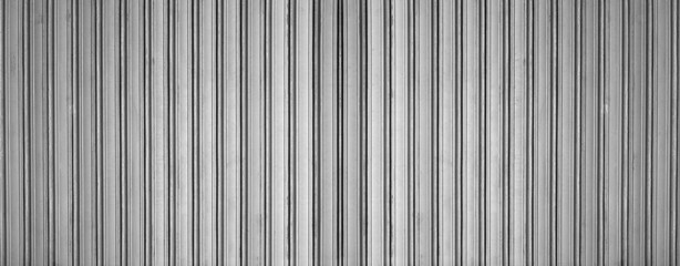 Steel corrugated panel with silver metal texture and iron sheet of zinc. Container roof and plate of white wall with tile pattern in aluminum. Vertical siding galvanized with ribbed surface. © Maxim Chuev