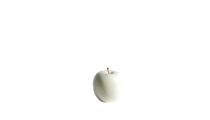 A single, pale-colored apple sits isolated against a stark, black background