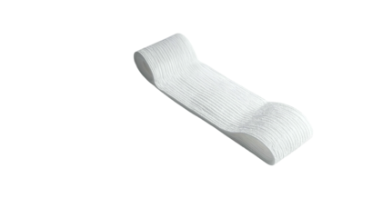 A stack of white paper disposable spoons, slightly curved and textured, on a dark backdrop