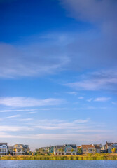 Idyllic view of Oquirrh Lake with homes and sky