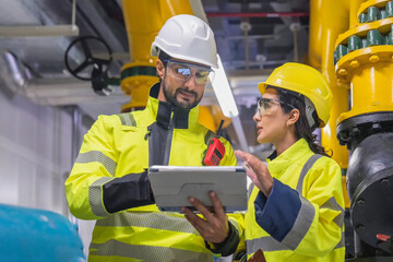 Engineer utilizes a tablet for real-time diagnostics of complex HVAC control systems.
