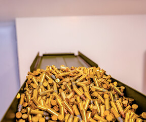 Reflective golden bullets on an open metal box