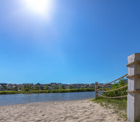 Rope fence and homes beside lake in Daybreak Utah