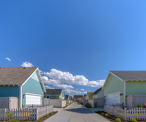 Rows of houses under blue sky and clouds in Utah