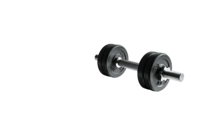 A dumbbell, weights on each side, rests against a dark, contrasting background