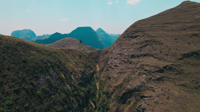 A breathtaking wide-angle shot capturing the extensive, dry, and rugged mountain landscape of the Codo de los Andes in Bolivia.