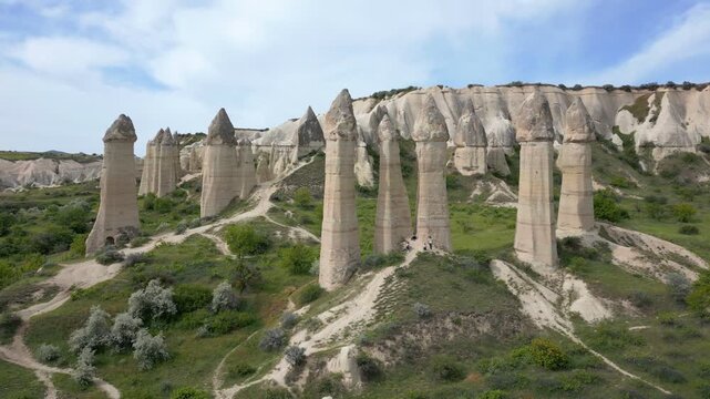 Love Valley drone aerial view exploring unique fairy chimney rock formations in Cappadocia, Turkey
