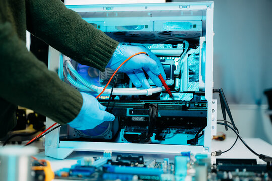 Closeup of expert soldering a green PCB board using precision tools. Ideal for electronics, circuit repair, engineering, tech - Powered by Adobe