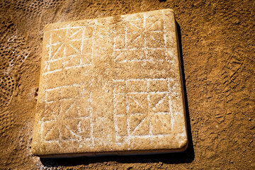 Base on dirt infield of softball and baseball field