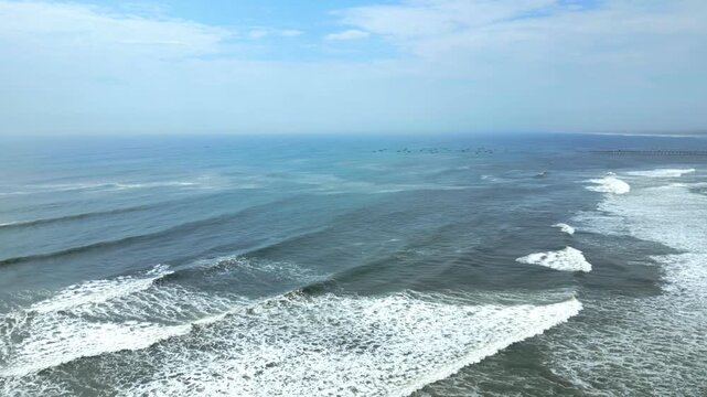 Aerial view of the coast of Eten, Lambayeque in northern Peru, with the lighthouse overlooking the Pacific Ocean and the arid coastal landscape in summer