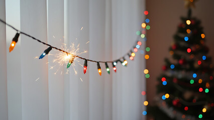 Christmas light short circuit. Holiday decoration fire hazard. Electrical problem with festive garland for New Year safety and home accident prevention, Holiday Electrical Fire Safety