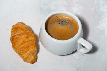 espresso and fresh croissant, top view