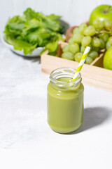 healthy superfood - green smoothie, vertical top view