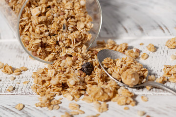 homemade granola in a jar on a white background
