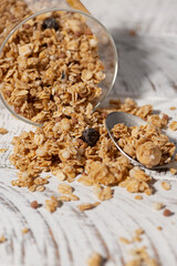 homemade granola in a jar on a white background, vertical