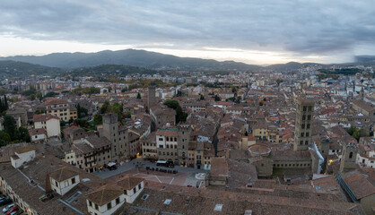 Aerial view of Arezzo medieval town center Piazza Grande, palaces, gothic churches Santa Maria della Pieve