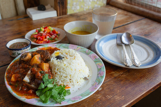 yemeni dishes on the wooden table in the arabic restaurant in jeju island
