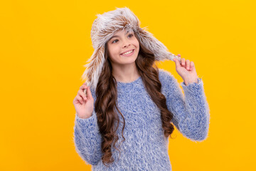 portrait of child wearing warm clothes. express positive emotion. winter fashion.