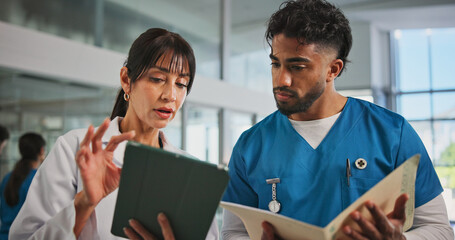 Tablet, plan and nurse with doctor in hospital lobby for advice with surgery, medicine or treatment report. Teamwork, woman and man with information, document and support for healthcare professional