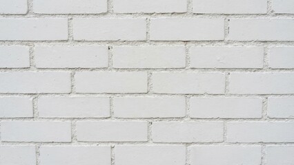 Obraz premium Textured White Brick Wall with Smooth Surface and Uniform Pattern for Minimalist Background
