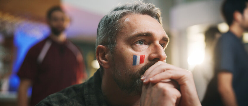 Pub, watch or man with stress for game, world cup tournament or soccer fan with online broadcast. Anxiety, football match or person with flag of France for team support, live streaming or sports bar