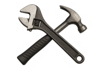 Adjustable wrench and hammer crossing together, representing home repair, construction, maintenance, and diy projects