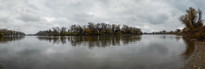 Wide winter panorama of a calm Sacramento River bend