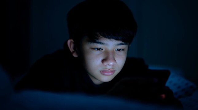 Addiction to social media among zoomers is not a joke. Should media platforms generating entertainment content be regulated for minors in some way? Addicted to gadget. Internet user. Online