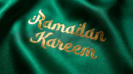 Ramadan Kareem golden text on waving green fabric background.