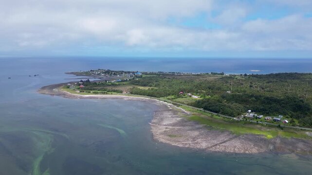 Hualaihue, Chile: Aerial view of coastal area Hualaihue, commune in Lake district of Chile on sunny day. Taken with orbit motion