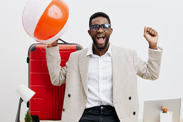 Confident joyful man with travel accessories holding beach ball smile excited positive cheerful...