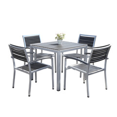 A square metal outdoor dining set with four chairs and a small potted plant on a black background.