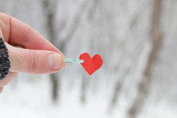Creative winter background with blue paper heart. © Markgraf Ave