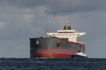 MARITIME TRANSPORT - A large bulk carrier is sailing into sea port
