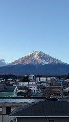 Mount Fuji, Japan, with a village in the foreground.