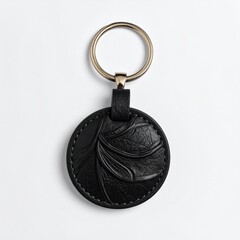 Black leather keychain with embossed leaf design.  Gold keyring