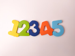 These are colorful wooden or foam educational numbers 1 through 5