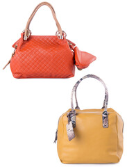 A small handbag with a textured front flap, a short shoulder strap, and a butterfly-shaped metal detail on the front.	
