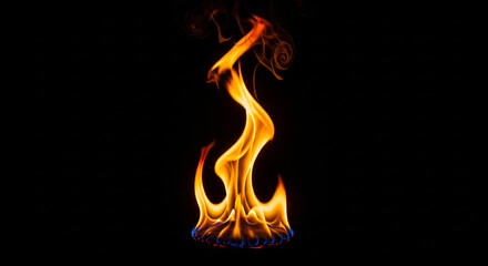 Fierce fire rising with swirling flames against a pitch-black background
