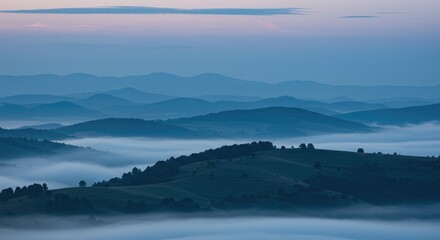 Fototapeta premium Misty mountain range at dawn