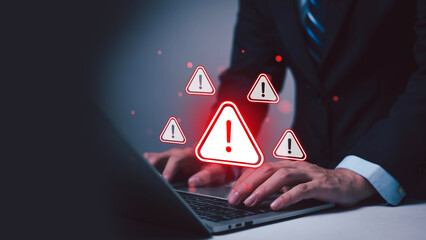 Cyber ​​attack alert on laptop. Cyber ​​attack on computer network. Virus, spyware, malware or malicious software. Businessman background. 