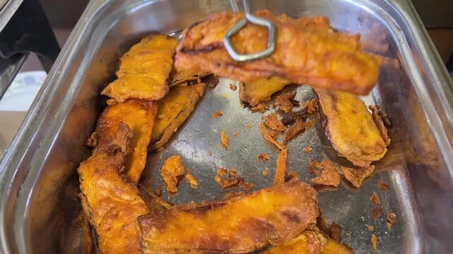 Beguni fry, a Bengali food prepared with brinjal.