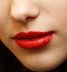 Fototapeta premium A woman's lips are painted red