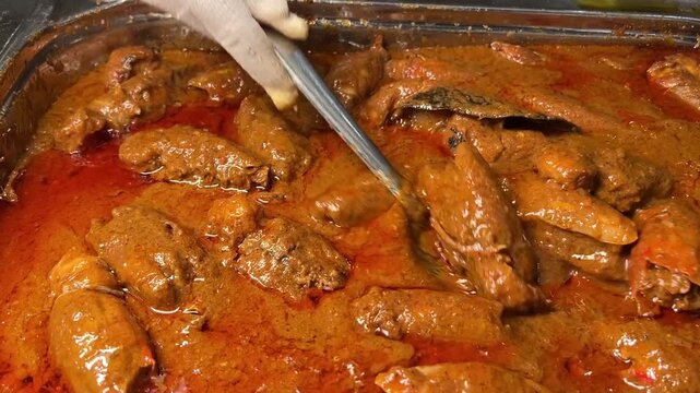 Spicy Chingri Malai curry served in a wedding in India